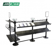 Supermarket shelf with wire basket hooks and billboard queueing system near the cashier